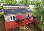 Large back deck with ample seating and a BBQ grill, with great views of Greenville`s Swamp Rabbit Trail